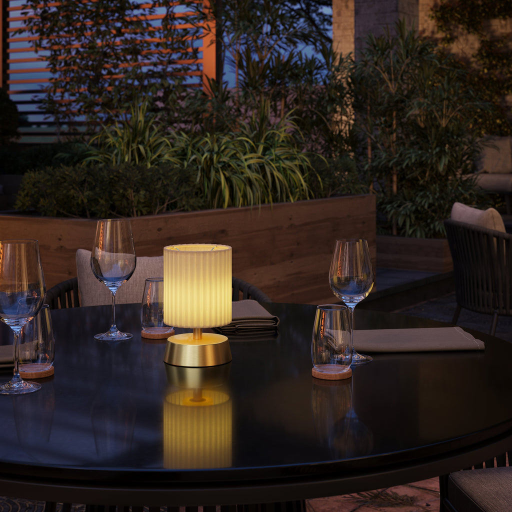 Cleo Cordless Table Lamp in an outdoor dining setting - Insight Cordless Lighting